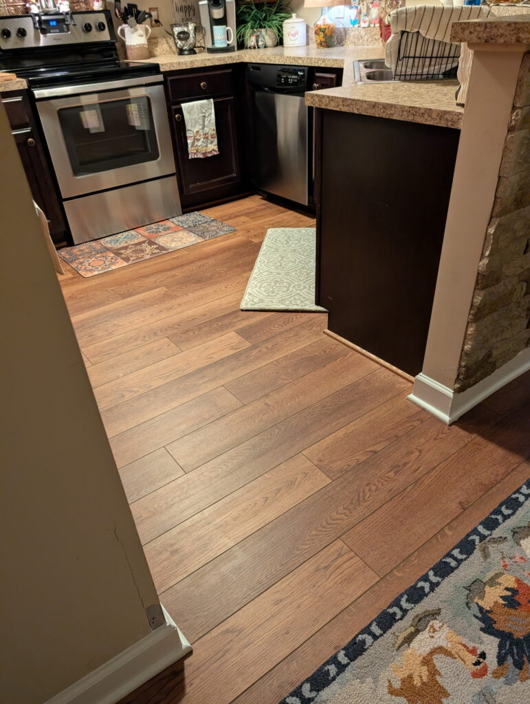 New luxury vinyl plank flooring installed after water damage repair