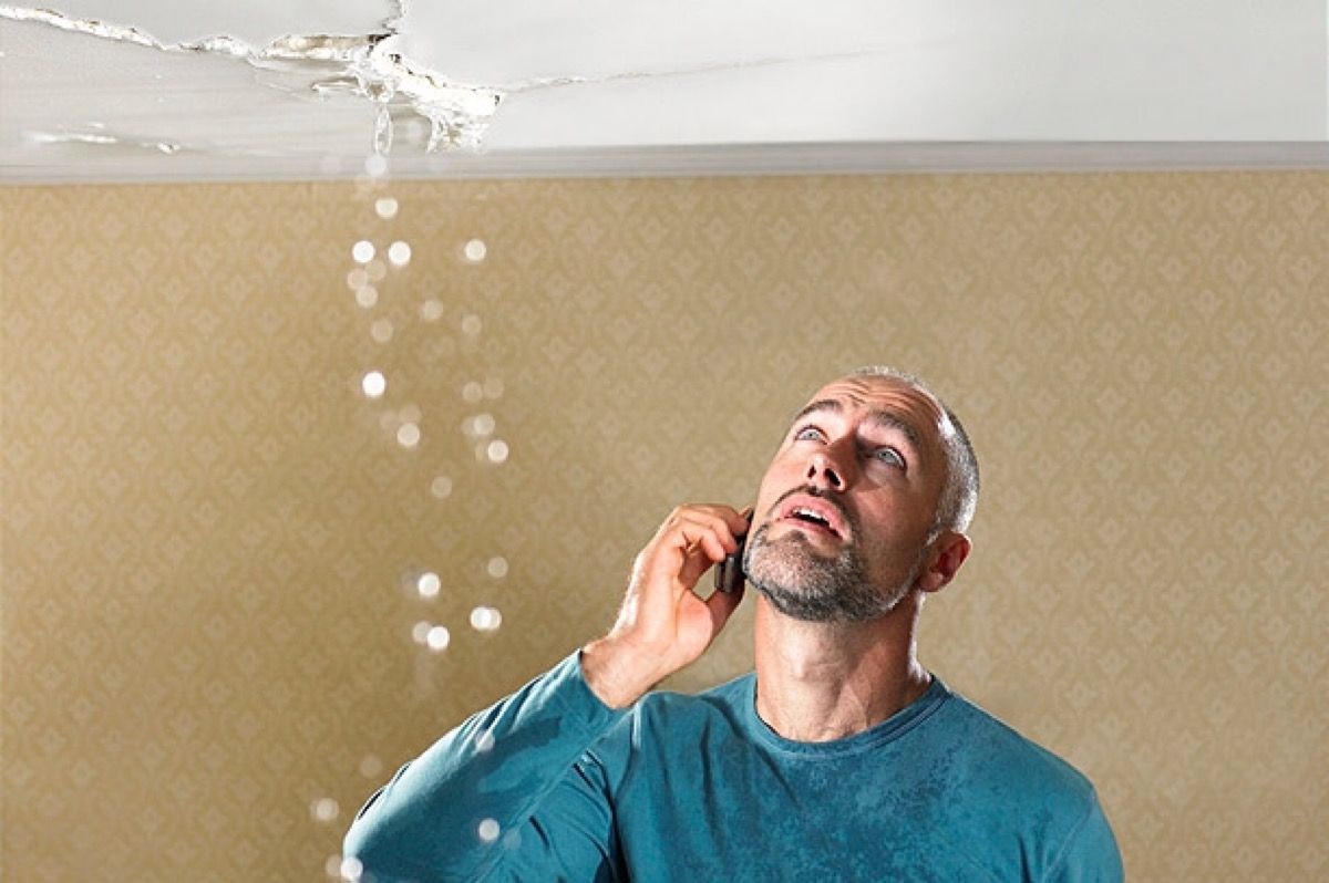 A local emergency water damage restoration crew extracting water from a flooded home.