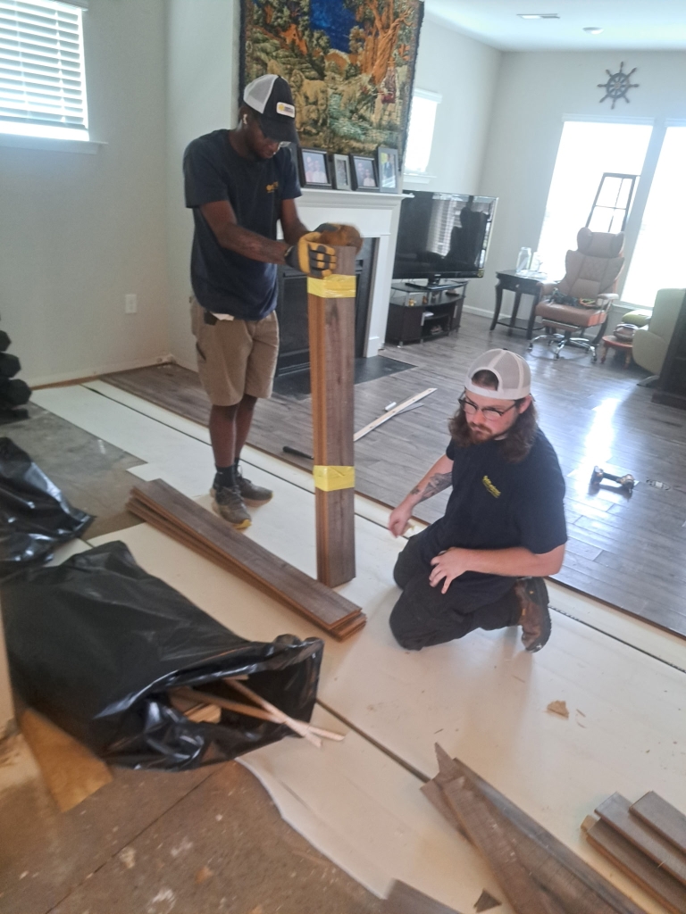 Water damage restoration and structural drying equipment set up after a second-floor bathroom overflow in New Hill NC