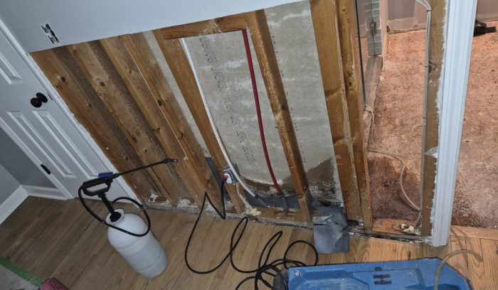 Flood cut drywall and air scrubber during emergency water extraction in Apex NC