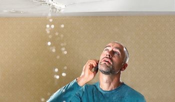A local emergency water damage restoration crew extracting water from a flooded home.